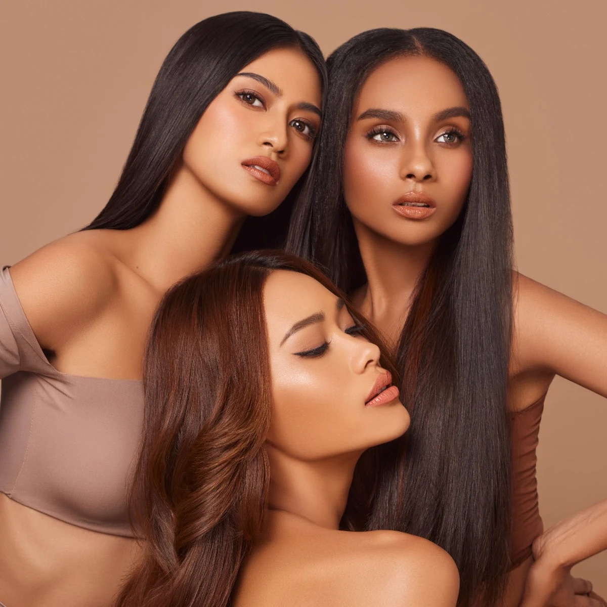 Three models expressing their individual beauty in a Teviant campaign